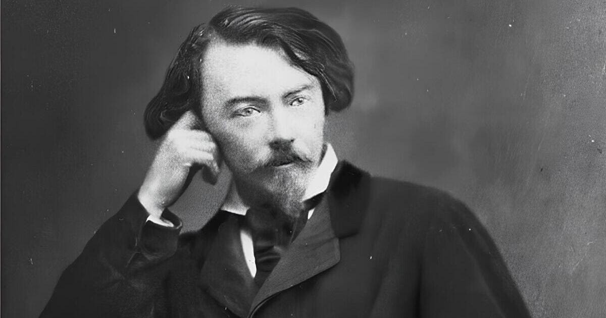 Foto del 1886 che ritrae Villiers de L'Isle-Adam seduto a un tavolino